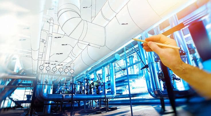 Engineering team collaborating over blueprint documents.